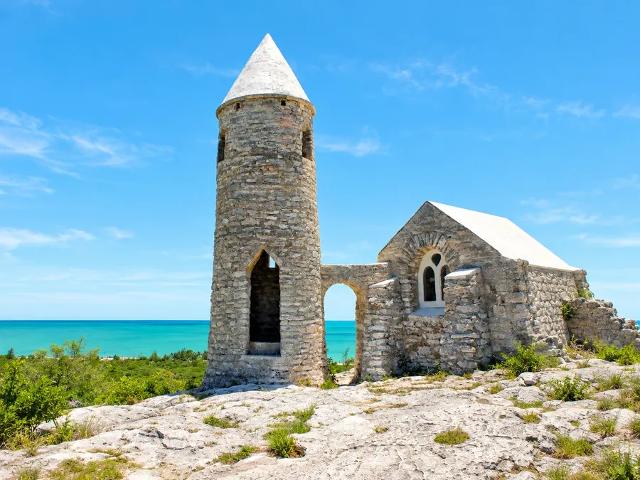 The stone Hermitage on Mount Alvernia on Cat Island, a round tower and small chapel above the turquoise sea