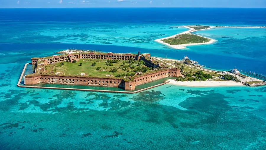 Fort Jefferson at Dry Tortugas from the air, the hexagonal brick fort ringed by reef and sand