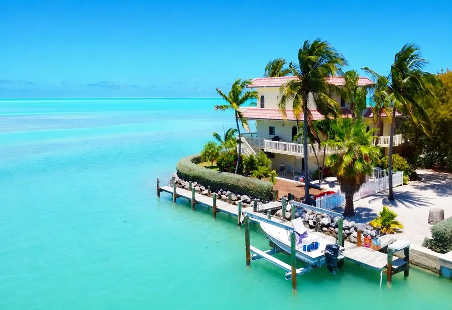 A Florida Keys waterfront house with its own dock and skiff on the turquoise flats